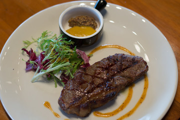 grass fed 250g with cafe de paris butter and mustard on the side and salad