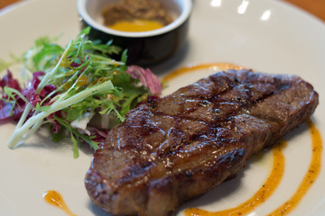 grass fed 250g with cafe de paris butter and mustard on the side and salad