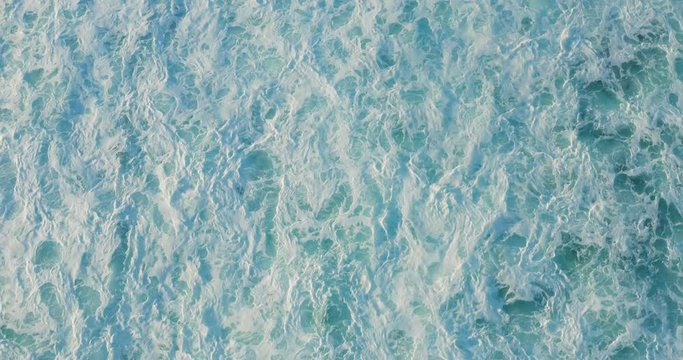 Aerial view of gurgling ocean churning and moving creating an interesting background texture, ocean movement texture background