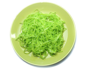green noodles on dish isolated on white background
