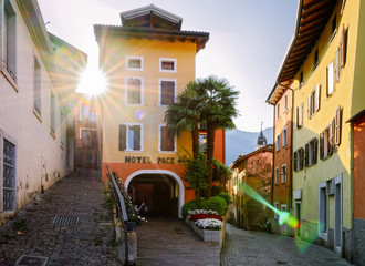 Cityscape with hotel building of Arco city center near Garda lake of Trentino of Italy. Street with house architecture at Old town in Trento near Riva del Garda. Travel and tourism. Sunrise in morning