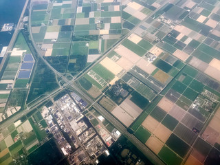 Aerial views of fields, waterways and highways outside of Amsterdam 