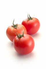 fresh tomatoes isolated on white background