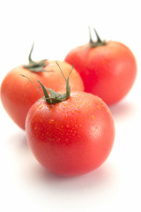 fresh tomatoes isolated on white background