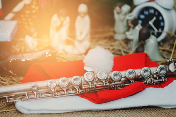 close up of flute with blurred  Christmas  decoration on table background