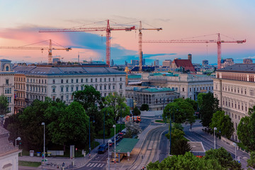 Fototapeta na wymiar Skyline and cityscape on Museumstrasse in Vienna of Austria at sunset. Wien in Europe. Panorama. Street view. Building architecture landmark. In summer. Blue sky with clouds. Evening