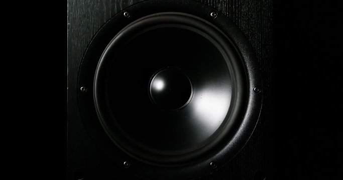 CLOSE UP moving sub-woofer music speakers vibrating membrane white strobe pulsing light