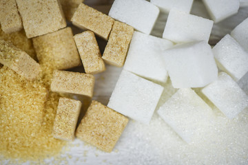 sugar cubes background / white and brown sugar