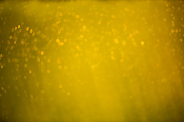 abstract gold and white bokeh and bubbles in the water