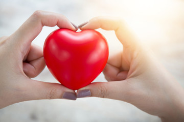 Woman hold red heart