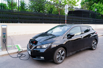 Electric Car Charging station at Vienna, Austria. Battery hybrid vehicle eco charger. Future energy...