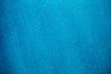 abstract blue and white bokeh and bubbles in the water