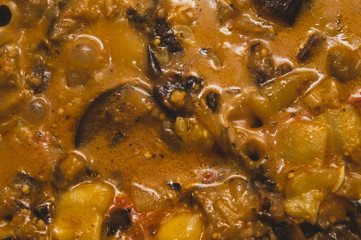 Stewed vegetables. ragout with eggplant and squash. cooking process of vegetarian food. ratatouille close up