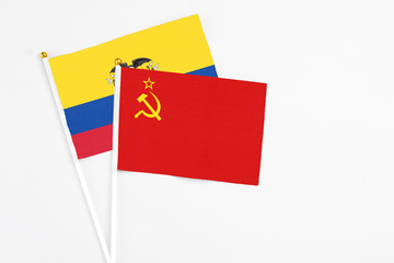 Soviet Union and Ecuador stick flags on white background. High quality fabric, miniature national flag. Peaceful global concept.White floor for copy space.