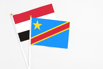 Congo and Egypt stick flags on white background. High quality fabric, miniature national flag. Peaceful global concept.White floor for copy space.