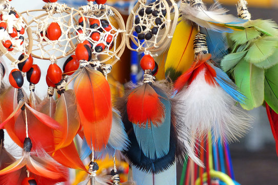 Colorful dream catchers with birds feathers at craft market in Cuenca, Ecuador