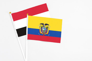 Obraz premium Ecuador and Egypt stick flags on white background. High quality fabric, miniature national flag. Peaceful global concept.White floor for copy space.