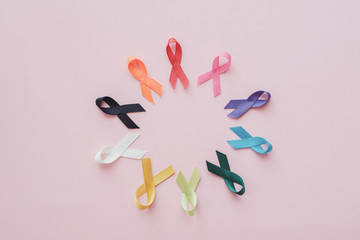 colorful ribbons on pink background, cancer awareness, World cancer day,  world autism awareness...