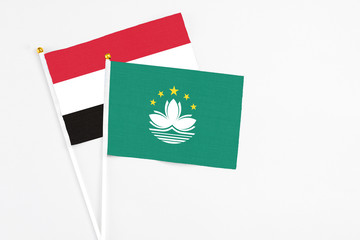 Macao and Egypt stick flags on white background. High quality fabric, miniature national flag. Peaceful global concept.White floor for copy space.