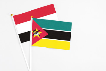 Mozambique and Egypt stick flags on white background. High quality fabric, miniature national flag....