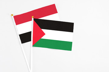 Palestine and Egypt stick flags on white background. High quality fabric, miniature national flag....