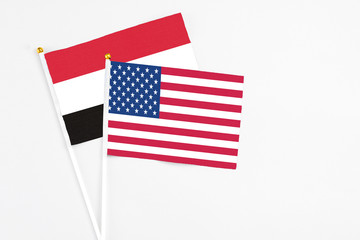 United States and Egypt stick flags on white background. High quality fabric, miniature national flag. Peaceful global concept.White floor for copy space.