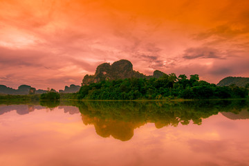 Fototapeta na wymiar Natural background of a large reservoir in Krabi,Thailand(Nong Thale)atmosphere surrounded by mountains,trees of various sizes, blown through the wind,blurred cool during the day,a viewpoint of travel