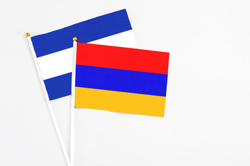 Armenia and El Salvador stick flags on white background. High quality fabric, miniature national flag. Peaceful global concept.White floor for copy space.