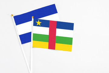 Central African Republic and El Salvador stick flags on white background. High quality fabric, miniature national flag. Peaceful global concept.White floor for copy space.