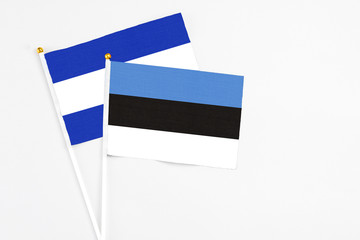 Estonia and El Salvador stick flags on white background. High quality fabric, miniature national flag. Peaceful global concept.White floor for copy space.