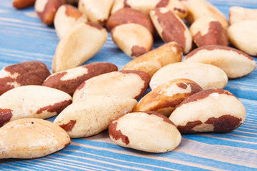 Heap of brazil nuts on old boards