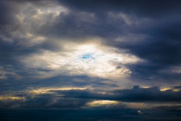 Naklejka na ściany i meble Clouds in sky against light on center