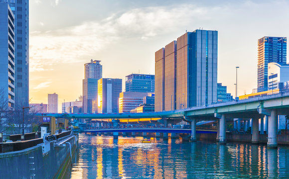 Dojima River and buildings at sunset in Osaka, Japan
