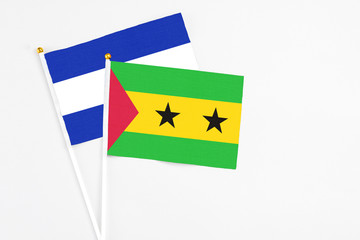 Sao Tome And Principe and El Salvador stick flags on white background. High quality fabric, miniature national flag. Peaceful global concept.White floor for copy space.