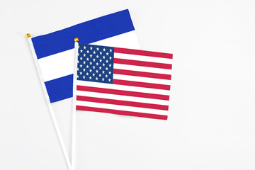 United States and El Salvador stick flags on white background. High quality fabric, miniature national flag. Peaceful global concept.White floor for copy space.