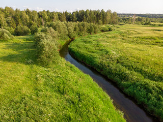 Fototapeta na wymiar Top view of the river and green meadows