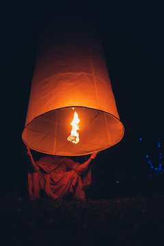Lighting candles, lanterns in the sky at night in the Lantern Festival