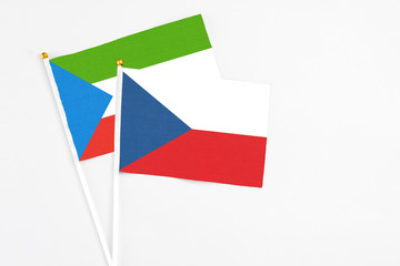 Czech Republic and Equatorial Guinea stick flags on white background. High quality fabric, miniature national flag. Peaceful global concept.White floor for copy space.