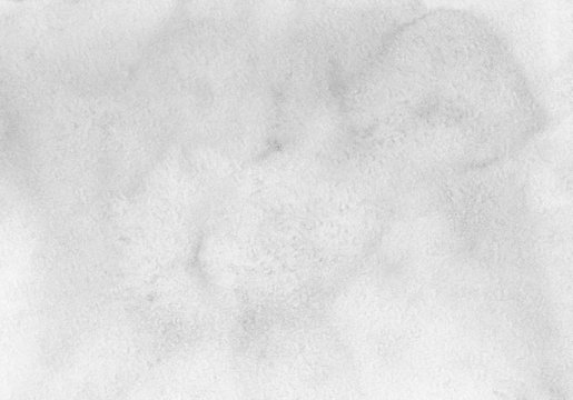 Watercolor light gray background texture. White and grey backdrop. Stains on paper.