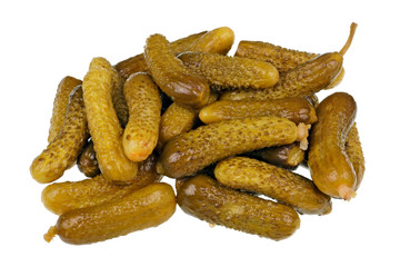 Daily food product - small pickled green gherkins cucumbers heap pile  isolated macro
