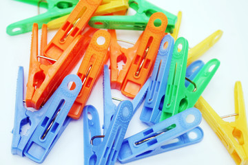 A lot of linen clips, clothespins of different colors.