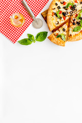 Homemade pizza on white background top view copy space