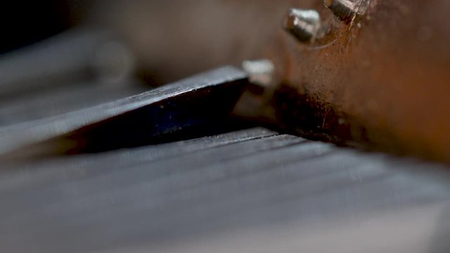 Extreme macro of the gears turning inside an old music box, also known as a snuff box.