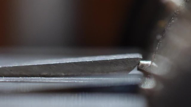 Extreme macro side view of the internal mechanism inside an old music box.