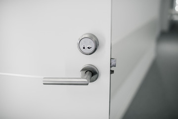 Electronic lock on door with white key card, Hotel electronic lock on white door