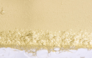 many bubbles in a layer of swee oil and water