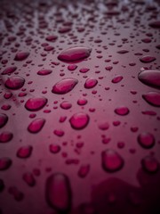 drops of water on red background