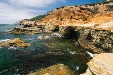 Sandstone cliffs, caves, and ocean view. San Diego Peninsula, California Coastline