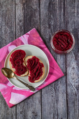 Sandwiches with natural homemade beetroot jam, with vanilla and sugar. On a stormy napkin. Healthy food, vegetarianism.