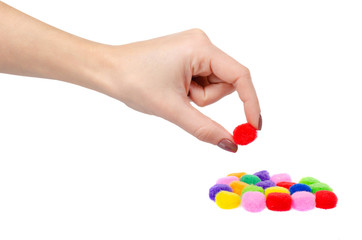 Colored pom pom, party and sewing decoration. Isolated on white.